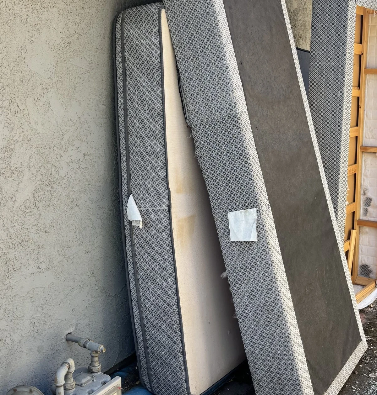 Two dirty old cabin air filters next to a clean new one