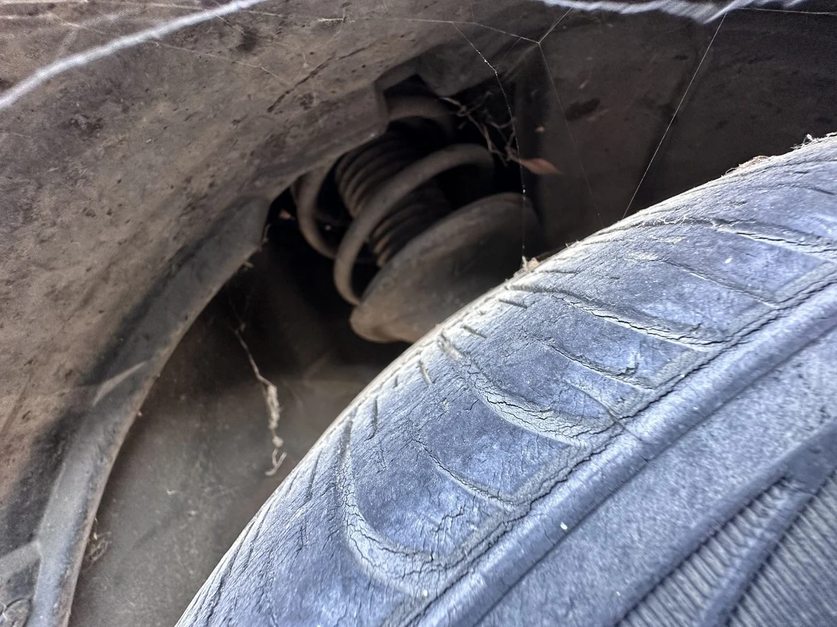 A tire sidewall covered in fine cracks